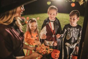 Young kids trick or treating during Halloween.