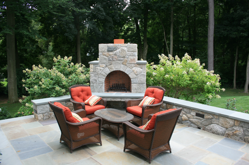 Stone fireplace outside on patio