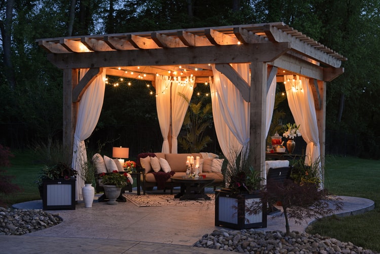 Outdoor seating area in backyard under gazebo