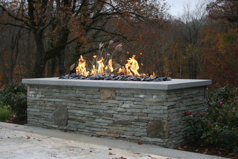 Stone fire pit in a backyard