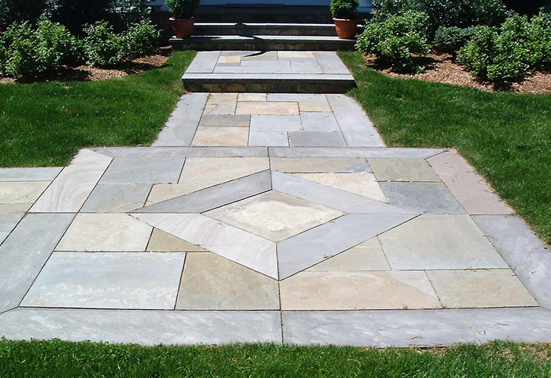 Natural stone walkway in front of a home