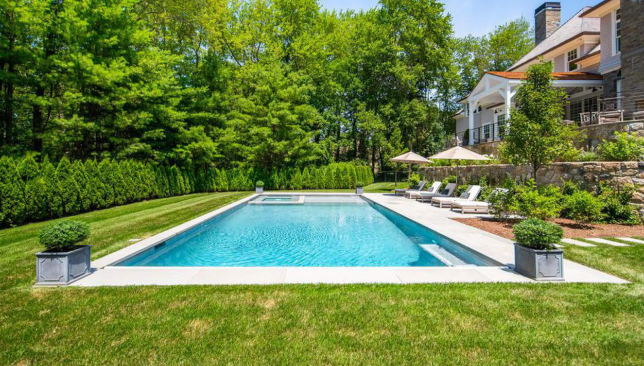 A backyard pool designed and installed by Ambrosio Landscape Solutions