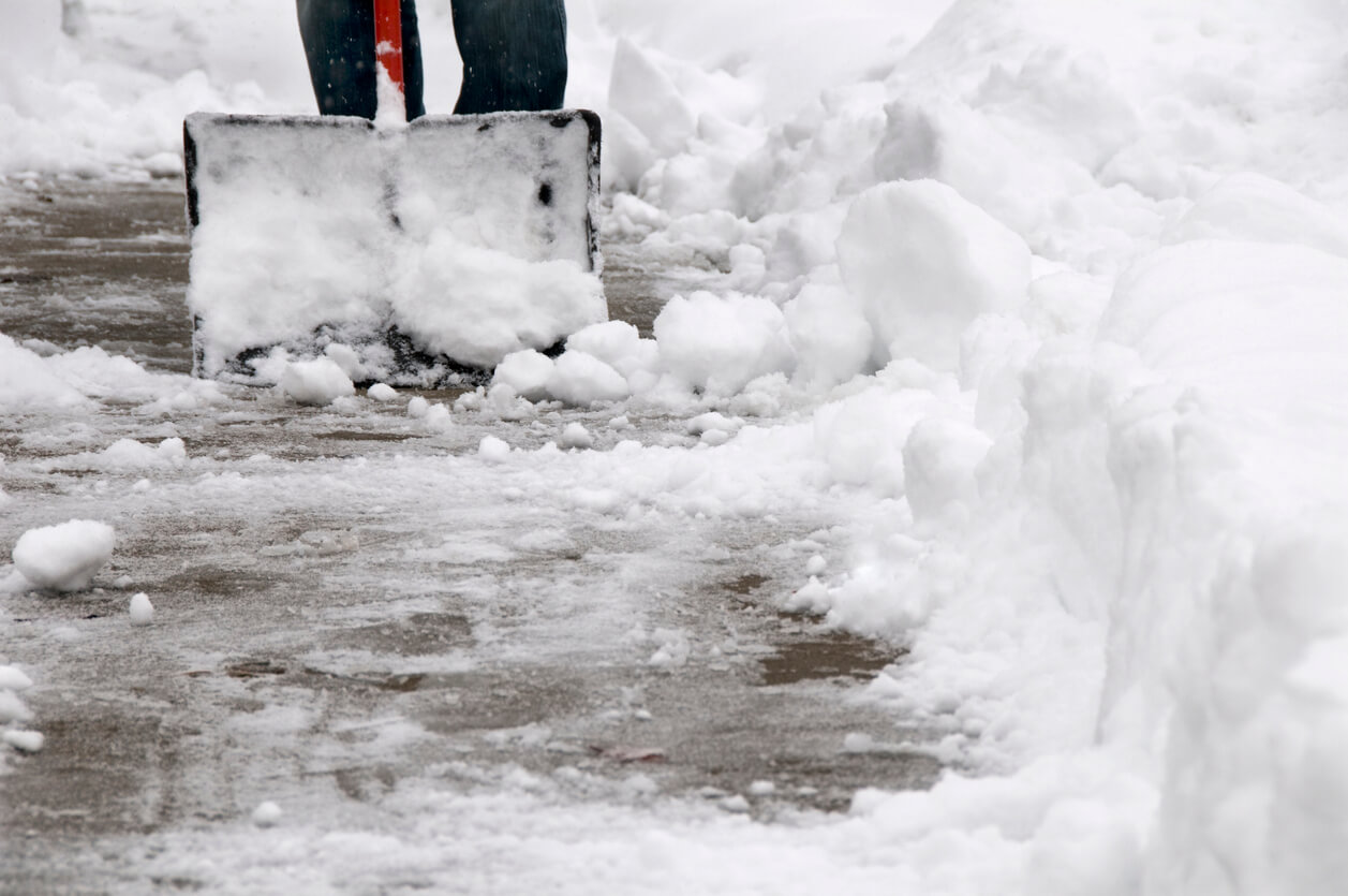 clearing heavy wet snow from the sidewalk after a winter storm.See more related images in my Winter Snow Removal lightbox: