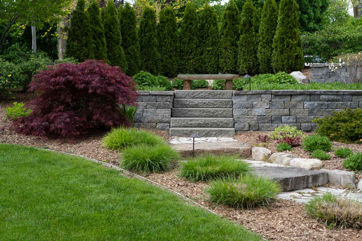 A professional landscaping job with stone path and stone steps.