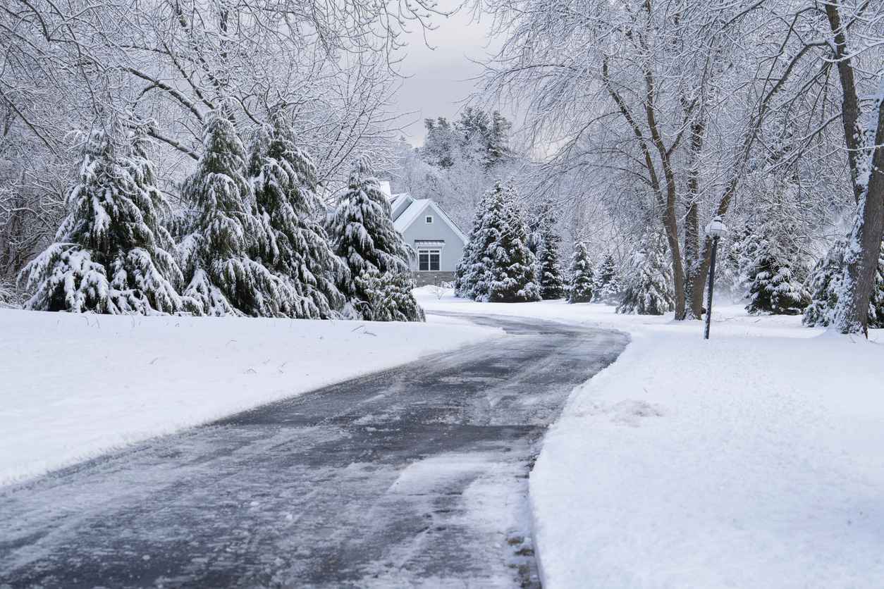 winter house and driveway after snow storm