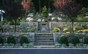 landscape with two stone retaining walls and steps down the middle