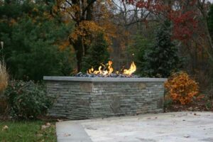 A fire pit by Ambrosio Landscape Solutions